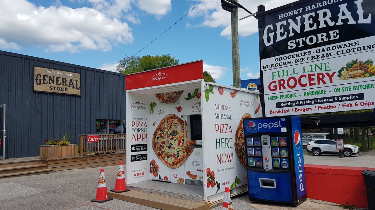 An outdoor PizzaForno vending machine that is in front of the Honey Harbour general store in Georgian Bay.