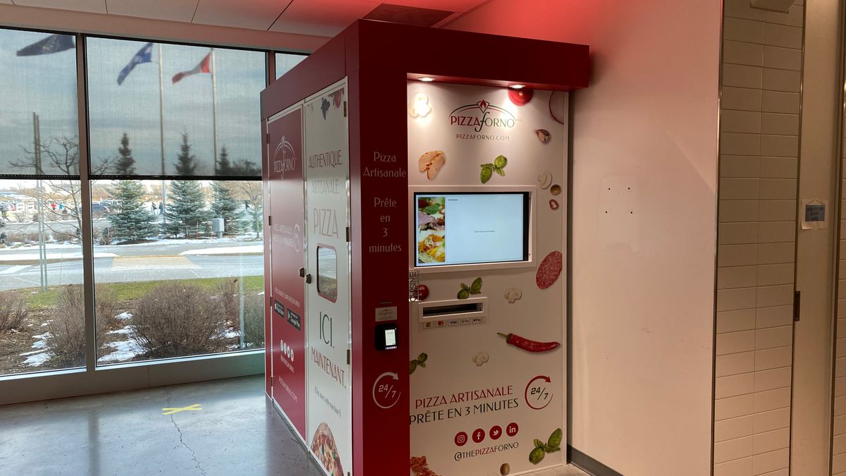 A picture of a PizzaForno machine located inside the building at Airbus, Quebec.