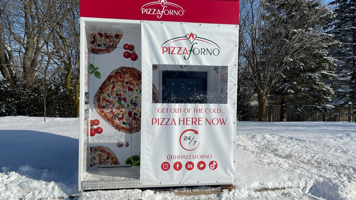 A automated pizza restaurant at the side of Toronto Street South in Markdale that is sitting on top of the snow during the winter.