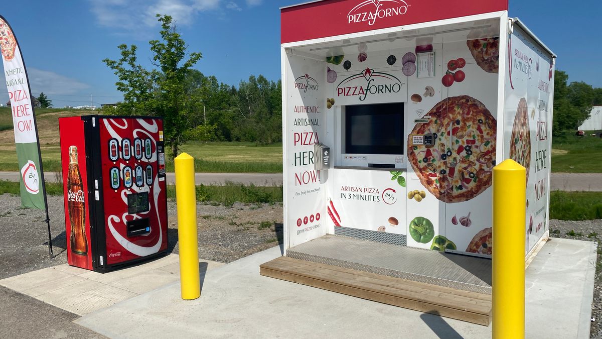 An outdoor PizzaForno automated pizza vending machine built on a concrete slab in Pembroke, Ontario.