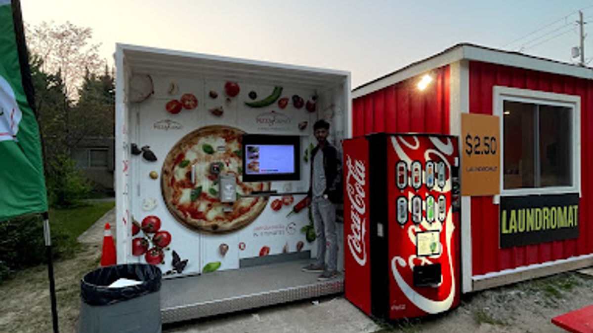 An outdoor automated pizza restaurant machine that is located in Wasaga Beach off of River Road.